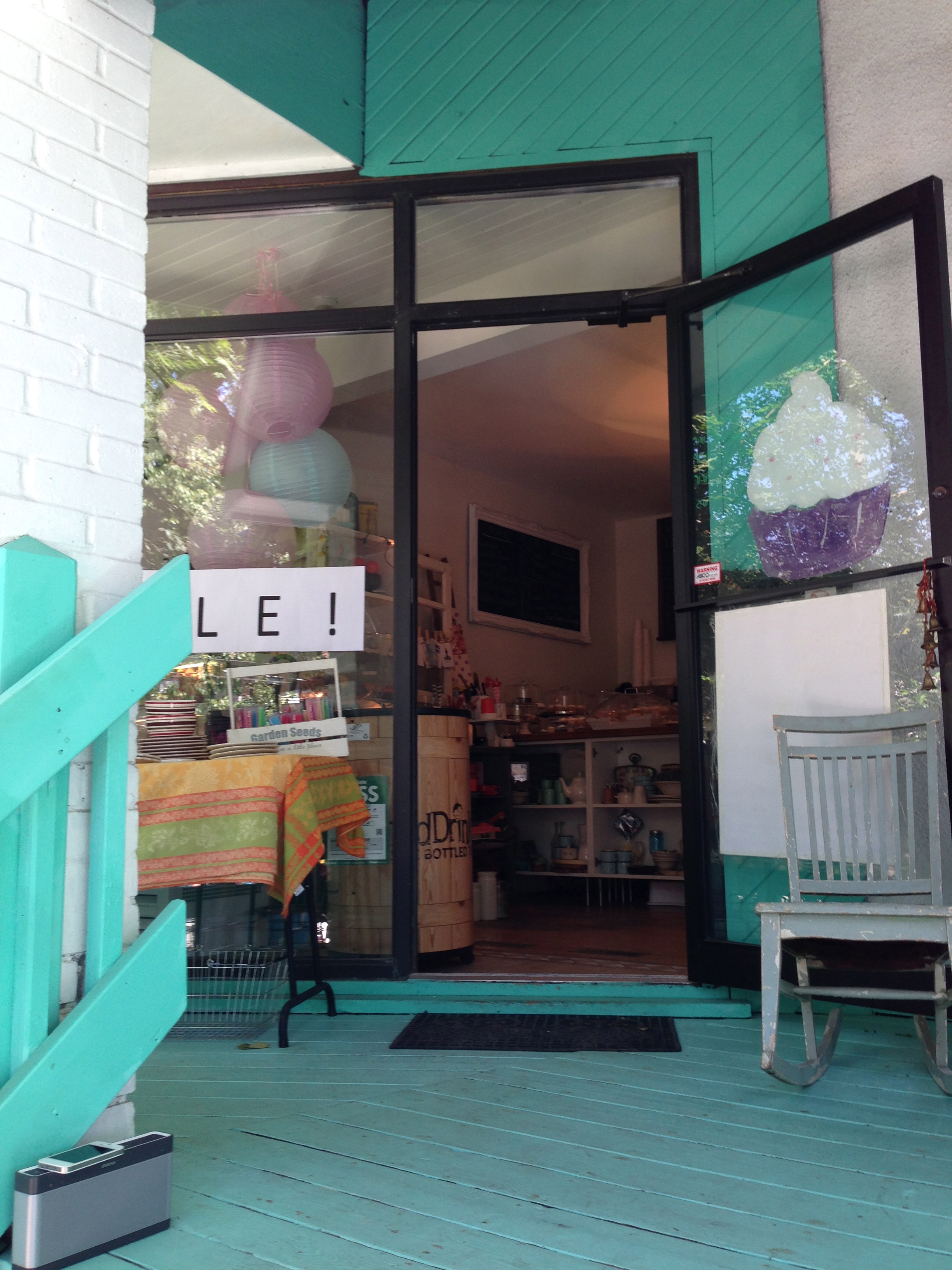 The entrance to the cute Life is Sweet bakery and gift shop.